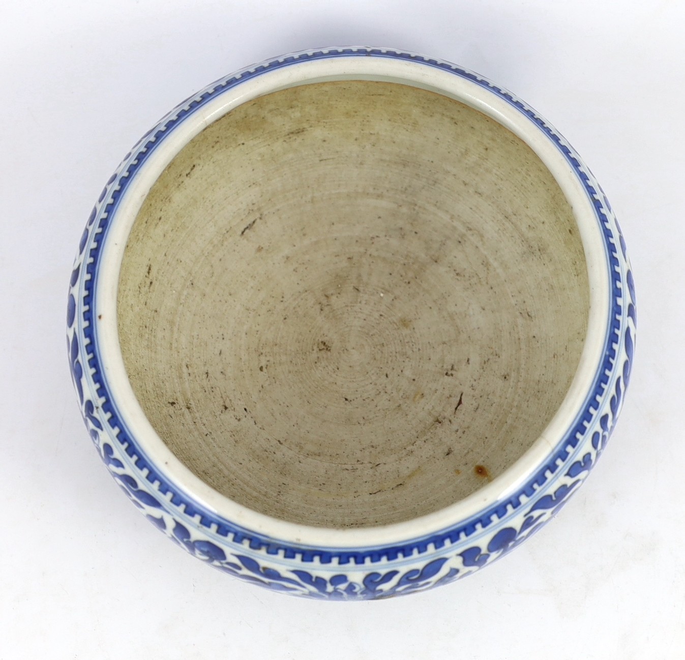 A Chinese blue and white ‘alms’ bowl or censer, cyclical date for the 56th year of the reign of Kangxi corresponding to 1717 and of the period, 21cm diameter 9cm high, two hairline cracks